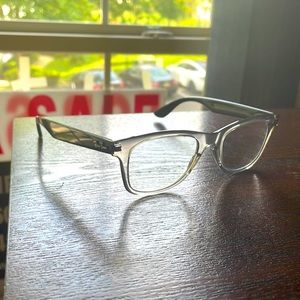 One pair unisex Ray-Ban 1.75 readers ,transition gray smoke ,black sided frames